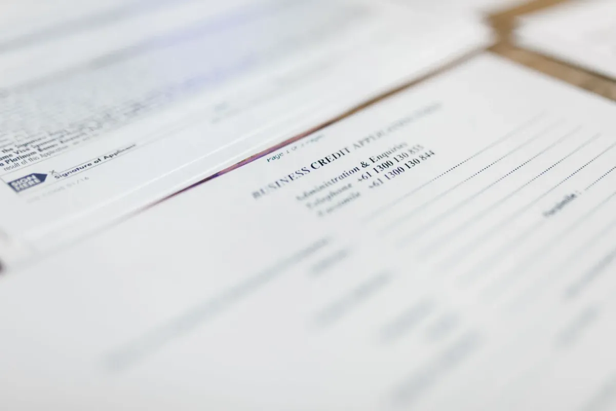 Credit application papers laid out on a desk.