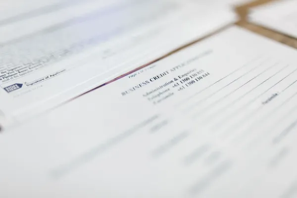 Credit application papers laid out on a desk.