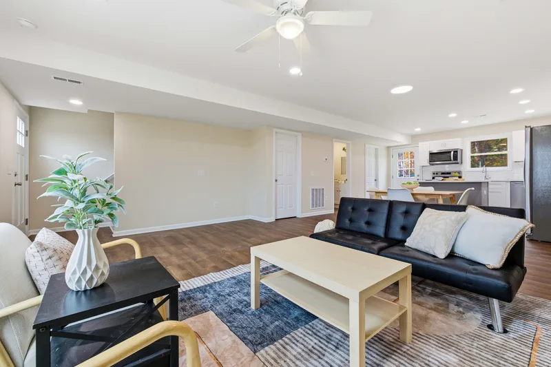 Open-concept main floor showing living room flowing into the kitchen and dining area
